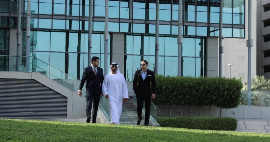 Western Businessman walking with the Arab Businessmen|-
