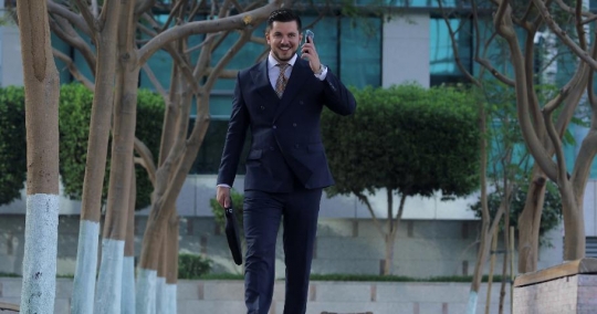 Western Businessman answered phone call walking|-
