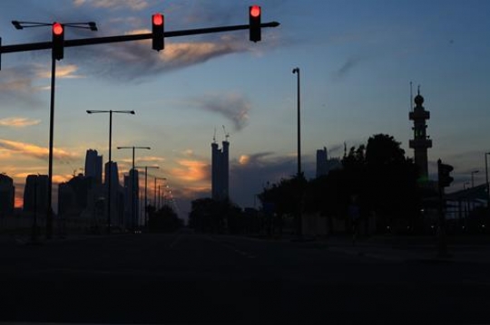 city scene at dawn sunrise with traffic lights