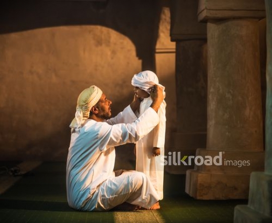 Kid with grandfather at the mosque|-