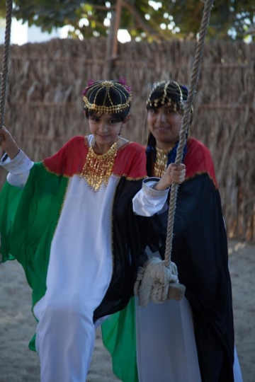 girls wearing traditional cust