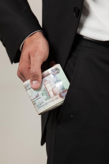 businessman getting a bundle o