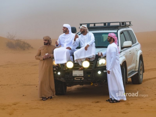 Young men hanging out in the desert