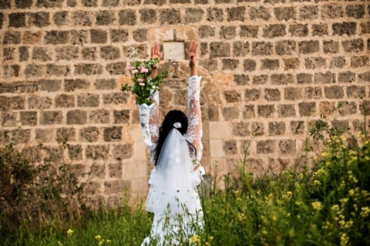 A Bride facing Wall