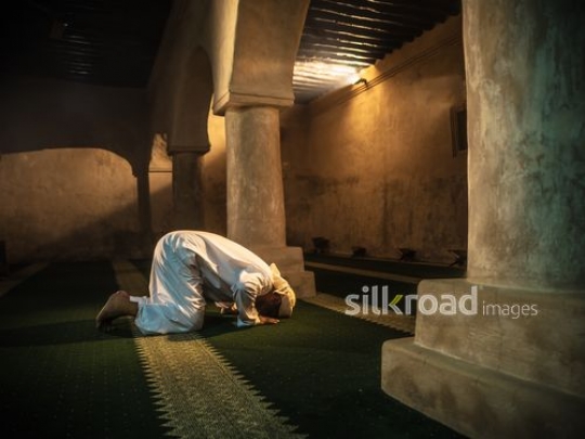 Old man prying at the mosque|-