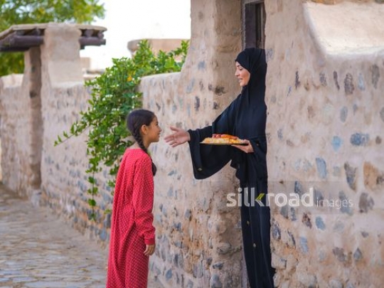 Lady greeting neighbor|-