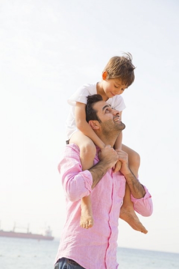 Dad and Kid having fun by the Beach of Aqaba