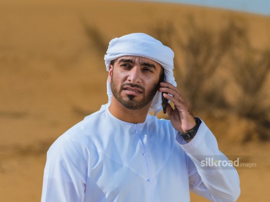 Man talking over the phone in the desert
