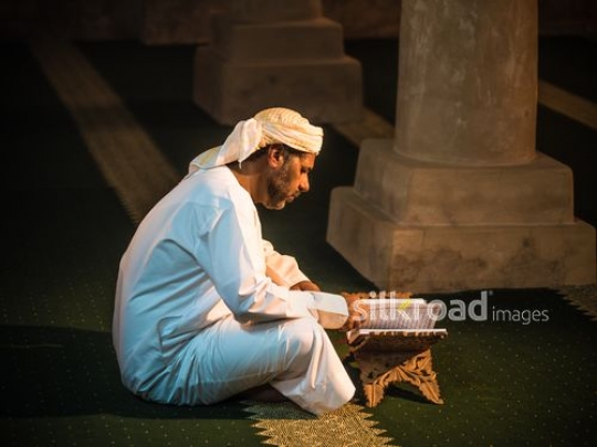 Old man reading qur'an at the mosque|-