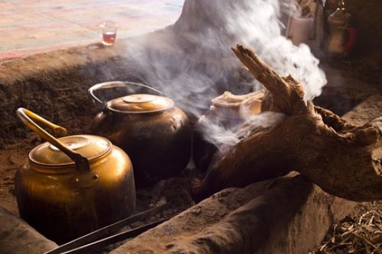 tea pots on fire with smoke