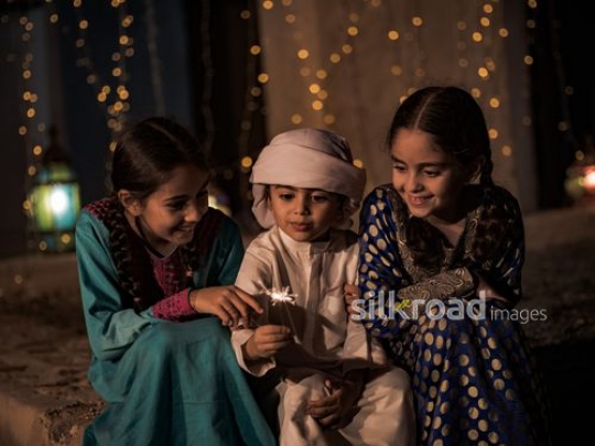 Kids celebrating with glowing matches|-