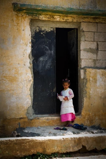 View of the town of Salt in Jordan, girls playing and reading.