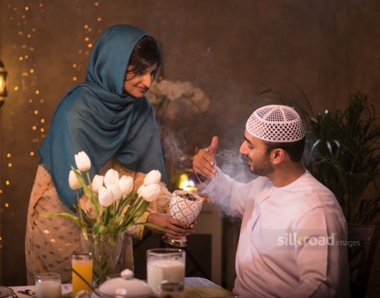 Wife perfuming husband|-