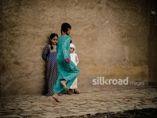 Kids playing hopscotch in the courtyard|-