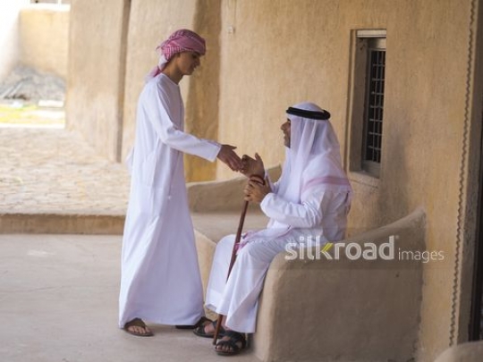 Teenager greeting grandfather|-