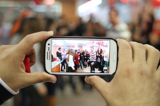 man taking photo with mobile cell phont