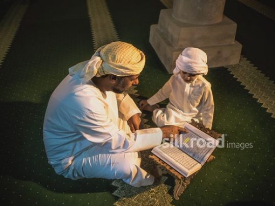 Grandfather reading teaching grandson qur'an|-