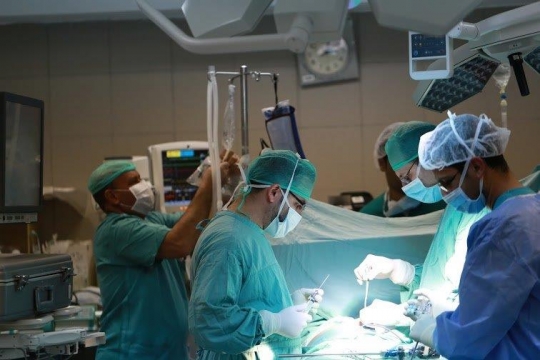 Surgeons Running an Operation