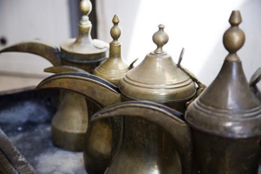 traditional coffee pots in row