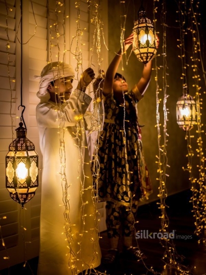 Brother an sister fixing ornaments|-