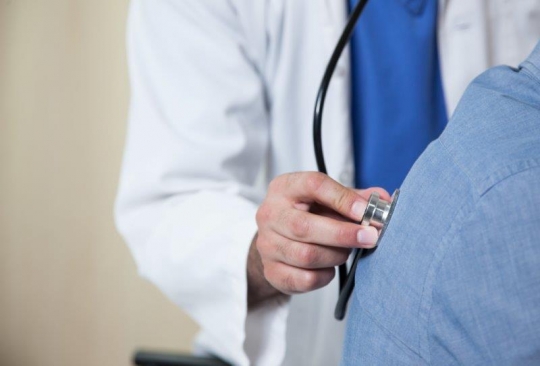 Doctor Checking out Patient