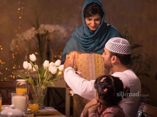 Wife perfuming husband|-