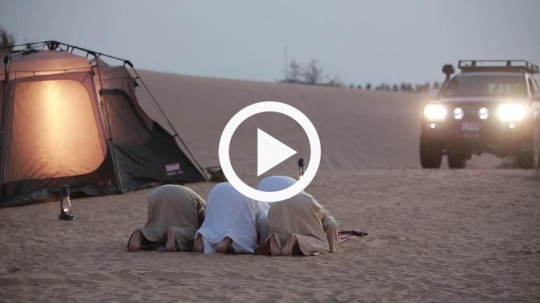 friends praying in wilderness