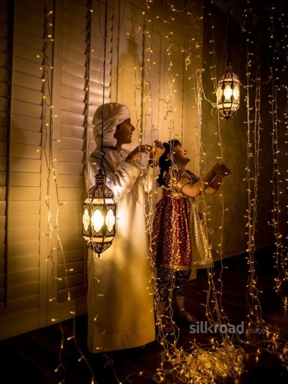 Kids fixing Ramadan lights|-