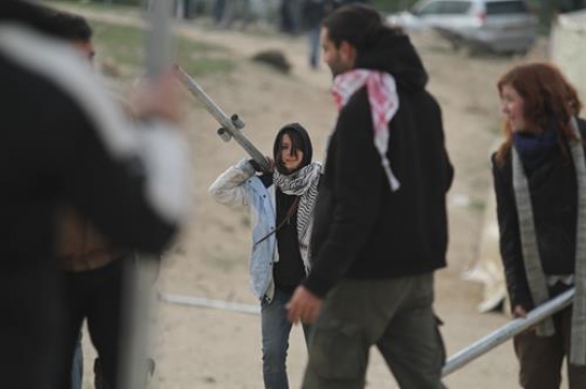 Palestinian demonstrators setting up tent at Bab al-Shams or Gate of the Sun 
