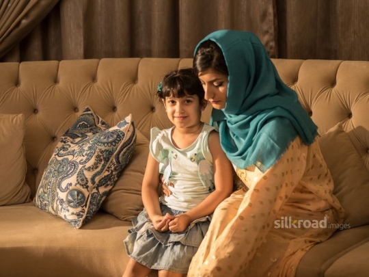 Daughter with Mom on sofa|-