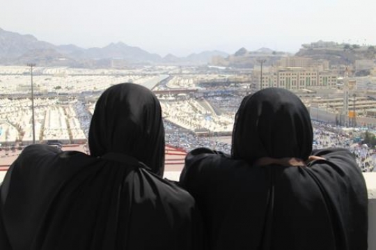two women in black looking at 