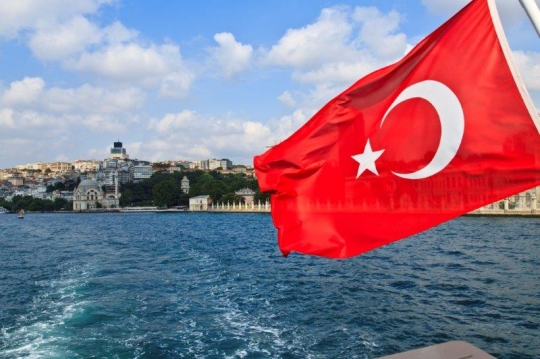 turkish flag n the back of a boat