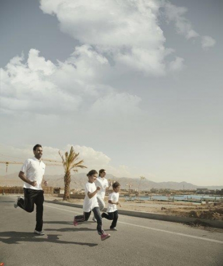 Family Running by the Sea 