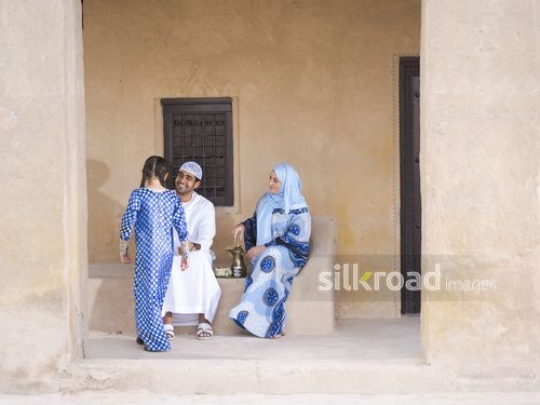 Daughter walking towards parents|-