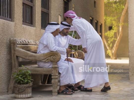 Arab son kissing the fathers head|-