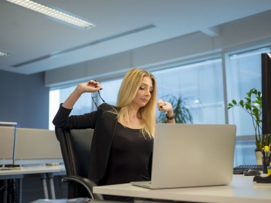 Business woman stretching|