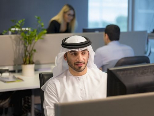 Business people at the office working by their desks|