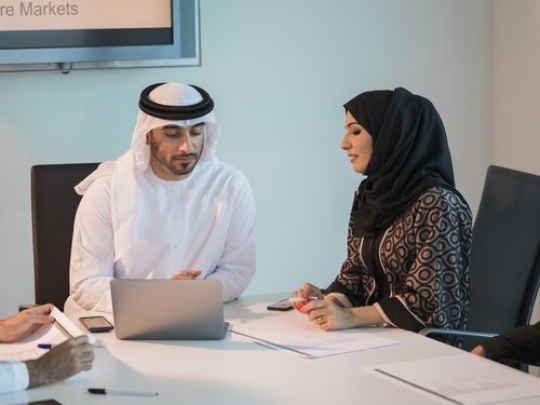 Middle Eastern employees during a meeting at the office|-