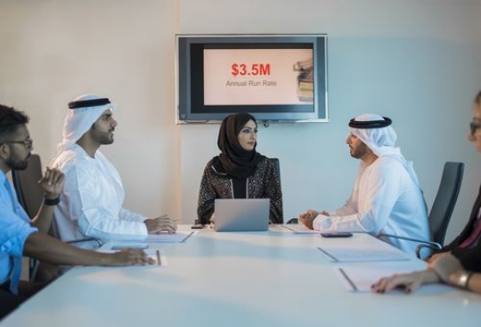 Businessman and woman talking to each other during a meeting|-