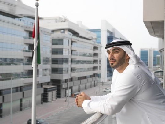Medium shot of a business man standing outside|-