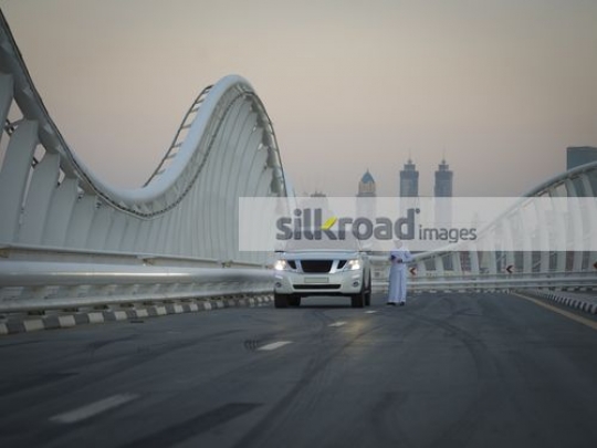 Middle Eastern man using his mobile|