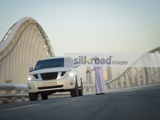 Middle Eastern man talking on the phone|