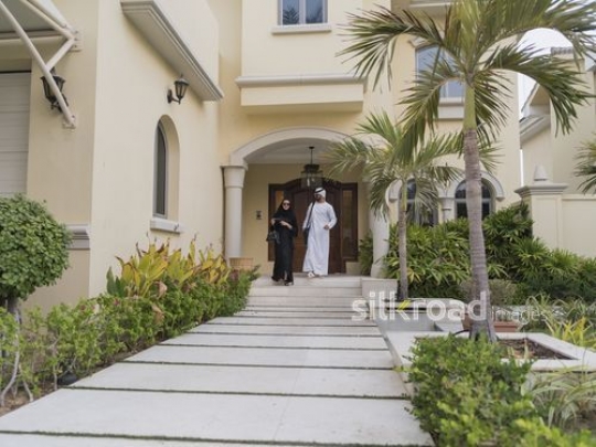Middle Eastern couple walking together outside|