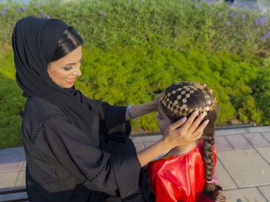 Mother and daughter celebrating national day|-