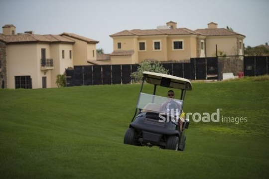 Arab man driving the Golf Cart|-