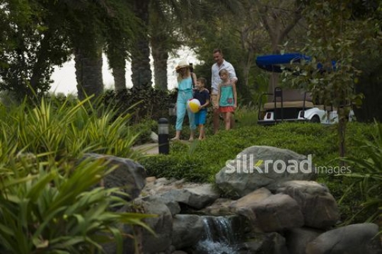 Western family walking together|-