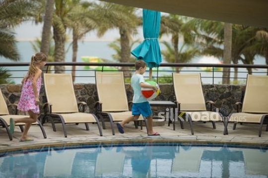 European kids running by the pool|-