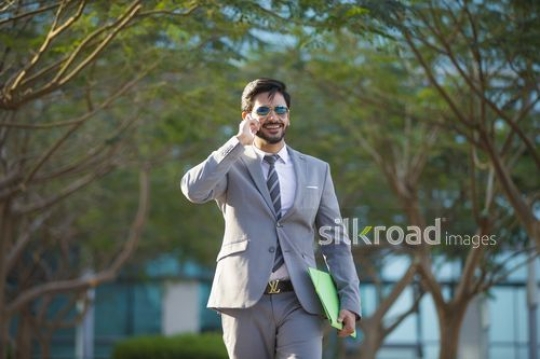 Businessman taking on the phone|-