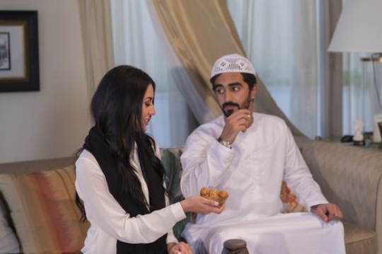 Middle eastern man looking at the woman|-