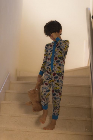 Young boy walking down the stairs|-